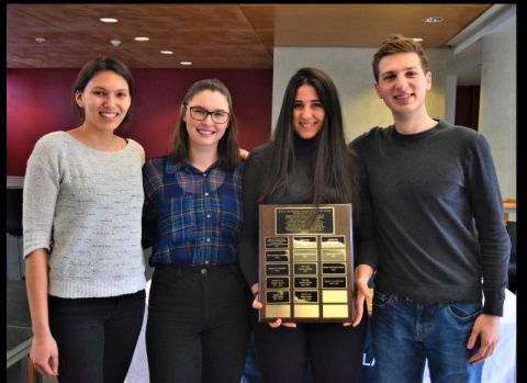 Accepting the 2019 Law Students’ Society Camaraderie Award are Queen’s Venture Law Society executive members Emma Wall, Heather Bonnell, Nataly Dil and Marc Vani. 