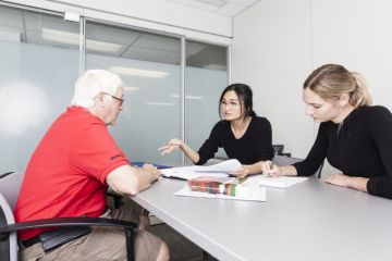 A Kingston-area senior receives free legal advice from Queen’s Elder Law Clinic student caseworkers in the downtown Queen’s Law Clinics office. Students gain practical experience in serving and interacting with clients, as well as a chance to develop their own style of practice before articling.