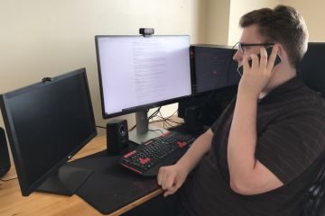QLA Outreach Co-ordinator Eli White, Law’21, listens attentively to a new client on his phone at home, so he can gauge the scale of the client’s legal problem and the emotional impact it is having upon the individual. 