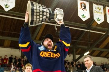 aels Captain Spencer Abraham, Law’20, hoists the Queen’s Cup after leading his team to victory in the exciting provincial championship game. (Photo by Jason Scourse)