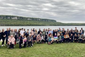 Queen’s Law students, faculty, and staff gather for a photo on Georgian Bay at the end of Professor Lindsay Borrows’ course, Indigenous Law in Context.