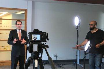 Associate Dean (Academic) Erik Knutsen is being filmed for one of his ILS modules; such videos are the first of three modalities used by Queen's Law instructors in teaching students how to develop skills.  