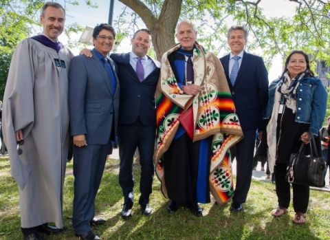Douglas Cardinal, LLD’18 (third right), outside Grant Hall on June 6 with Dean Bill Flanagan; Ovide Mercredi, former National Chief of the Assembly of First Nations; David Sharpe, Law’95, CEO of Bridging Finance Inc.; Mark Dockstator, President of the First Nations University of Canada; and Ann Deer, Indigenous Recruitment and Support Coordinator at Queen’s Law. (Photo by Greg Black) Douglas Cardinal, LLD’18 (third right), outside Grant Hall on June 6 with Dean Bill Flanagan; Ovide Mercredi, former National Chief of the Assembly of First Nations; David Sharpe, Law’95, CEO of Bridging Finance Inc.; Mark Dockstator, President of the First Nations University of Canada; and Ann Deer, Indigenous Recruitment and Support Coordinator at Queen’s Law. (Photo by Greg Black)