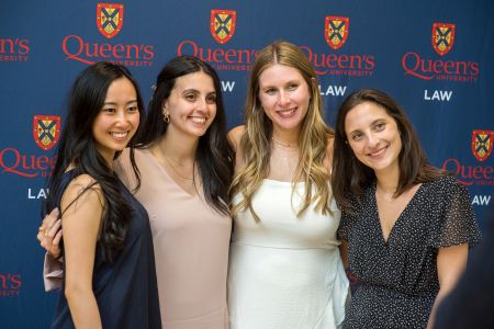 Four Queen's Law students