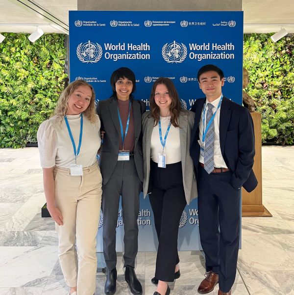 Students in front of the World Health Organization Sign