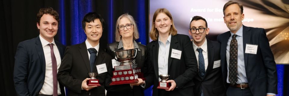 Federal Court of Appeal Justice Siobhan Monaghan presents the Donald G.H. Bowman National Tax Moot trophy to oralists Robert J. Smith, Li Yang Qu, Samantha Curry, Thomas Broccolini, and academic coach Martin Sorensen.