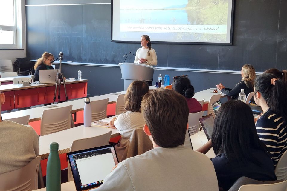 A professor lecturing in a classroom