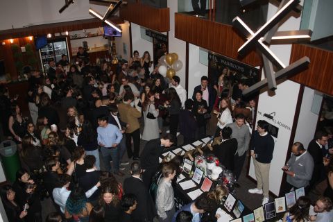 Students, faculty, and practitioners in the law and medicine communities bid on items and experiences with Queen’s Law professors in a silent auction.