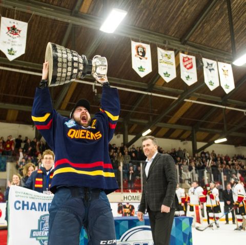 Gaels Captain Spencer Abraham, Law’20, hoists the Queen’s Cup after leading his team to victory in the exciting provincial championship game. (Photo by Jason Scourse)