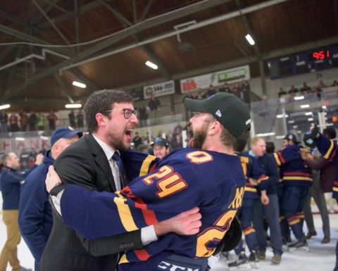Gaels Assistant Coach Kevin Bailie, Law’19, celebrates the win with Captain Spencer Abraham, Law’20, after Queen’s defeated Guelph in the Queen’s Cup championship game. (Photo by Jason Scourse)