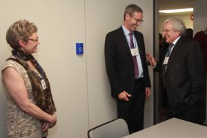 Photo by Bernard Clark. Donor Ed Kafka, Law’81 (right), shares a laugh with Dean Bill Flanagan in the interview room named for the Belleville lawyer while wife Sharon looks on.