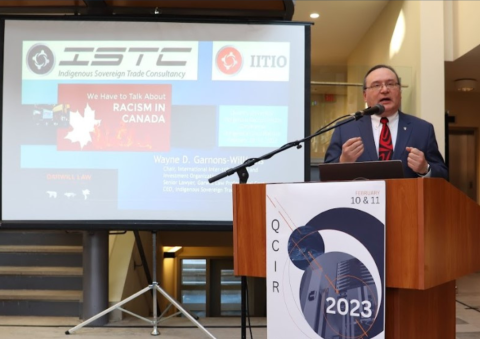 Wayne Garnons-Williams, Law’90, who had played a key role in negotiating the Indigenous Peoples Economic and Trade Cooperation Arrangement (IPETCA), presents the opening keynote address at the 2023 Queen’s Conference on Indigenous Reconciliation (QCIR) that focused on “Sustainable Pathways to Reconciliation.”