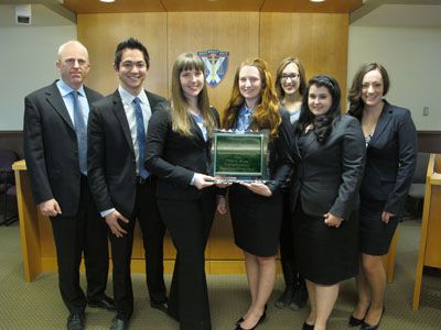 Professor Darryl Robinson, Sean Mitra, Lisa Scheulderman, Stephanie Hodge, Amélie Goudreau, Emily Evangelista and Anastasia-Maria Hountalas (left to right) won the Canadian rounds of the Philip C. Jessup International Law Moot Court Competition.