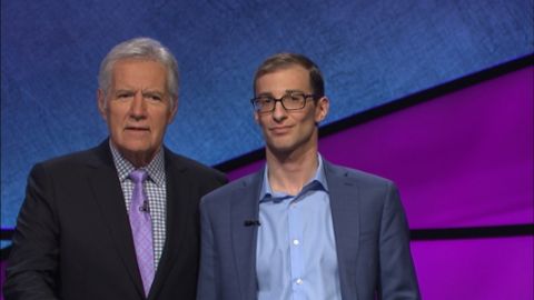 Jeopardy winner Jordan Nussbaum, Law’15, on the set with host Alex Trebek for what was a “fun” and “pretty surreal” experience. (Photo by Jeopardy! Productions Inc.)