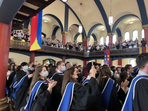 Newly minted JD graduates applaud their Law’22 classmates at Convocation in Grant Hall.