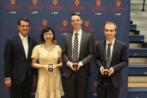 Dean Mark Walters with recipients of Law Medals, given to the graduates with the highest cumulative averages: Christina Tang (highest standing), Andrew Irwin (second-highest), and Oliver Flis (third-highest). Dean Mark Walters with recipients of Law Medals, given to the graduates with the highest cumulative averages: Christina Tang (highest standing), Andrew Irwin (second-highest), and Oliver Flis (third-highest).