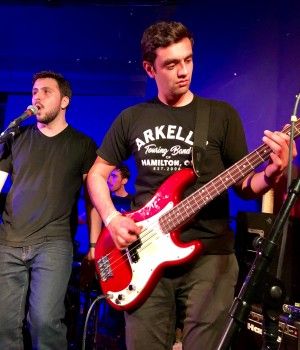 Law’19 students Frank Piazza and Brendan Smith and their band Uncivil Procedure entertain the crowd at Trinity Social in downtown Kingston during Lawlapalooza 2018.