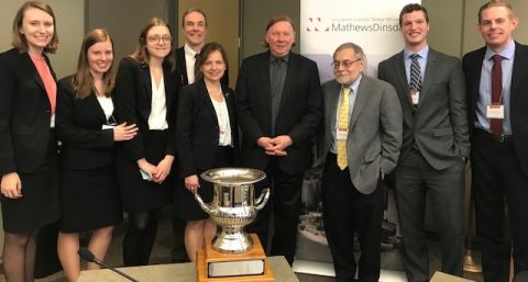 Queen’s Law team members accept the Mathews Dinsdale trophy from the competition’s panel of judges at the Ontario Labour Relations Board in Toronto on January 28. (L-R) Stephanie McLoughlin (student coach), Larysa Workewych (student researcher), Adriana Zichy (advocate), Kevin Banks (coach), Ginette Brazeau (Chair, Canada Industrial Relations Board), Justice Malcolm Rowe (Supreme Court of Canada), Bernard Fishbein (Chair, Ontario Labour Relations Board), Geoff Dunlop (advocate), and Geoff Tadema (student co