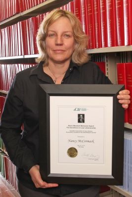 Professor Nancy McCormack, Denis Marshall Award recipient, in the Lederman Law Library