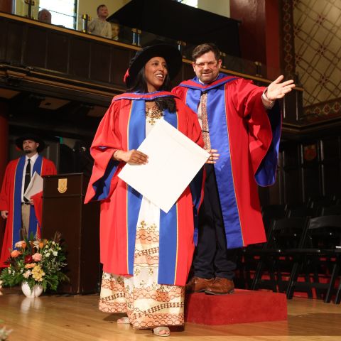 Hiwot Mekuanent receives her PhD in Law degree as she crosses the stage in Grant Hall at the Fall 2024 Convocation ceremony on Nov. 15. (Photo by Bernard Clark) Hiwot Mekuanent receives her PhD in Law degree as she crosses the stage in Grant Hall at the Fall 2024 Convocation ceremony on Nov. 15. (Photo by Bernard Clark)