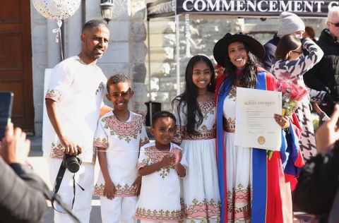 Hiwot Mekuanent, PhD’24, celebrates her graduation with her family outside Grant Hall. (Photo by Bernard Clark)