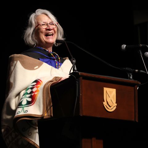 Queen’s honorary degree recipient Professor Val Napoleon, the Law Foundation Chair of Indigenous Justice & Governance at the University of Victoria, presents her Convocation address to the Queen’s Law Class of 2024 on June 21. (Photo by Bernard Clark)