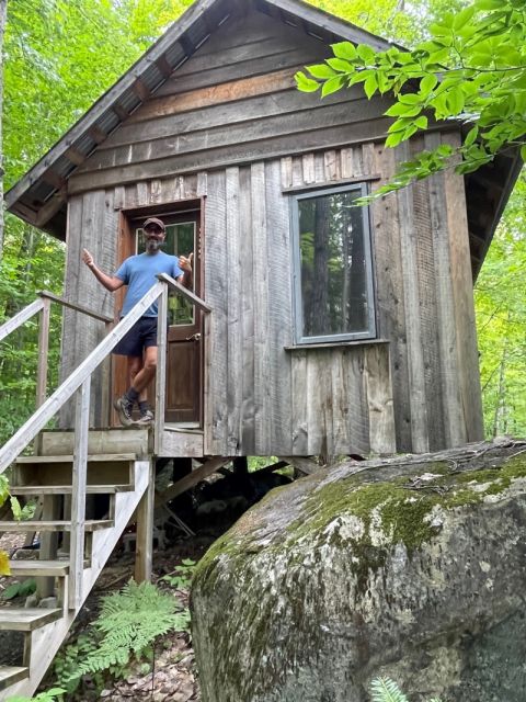 Professor Noah Weisbord steps outside his office shack in the Laurentian Mountains to take a break from researching group criminality. (Photo by Alana Klein)