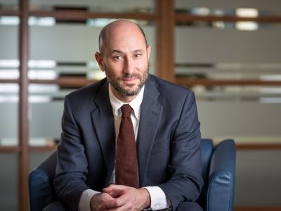 Professor Noah Weisbord is completing his book, The Crime of Aggression, which Princeton University Press calls “a riveting insider’s account of the high-stakes legal fight to enact historic legislation and hold politicians accountable for the wars they start.” (Photo by Andrew Van Overbeke)