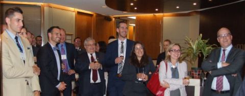 Ottawa alumni enjoy hearing the latest developments at Queen’s Law during the reception held at McMillan LLP. (Photo by Viki Andrevska)
