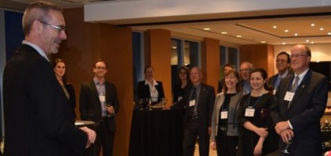 Alumni in Ottawa enjoy hearing about recent developments at Queen’s Law from Dean Bill Flanagan (far left) at a reception. (Photo by Viki Andrevska)