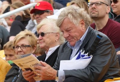 Peter Thompson, Law’65, seated with wife Fran Thompson (Arts’64), checks out the program before kickoff of the Gaels’ football home opener.  