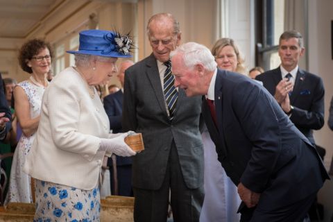 July 19, 2017: Queen Elizabeth II is presented with a gift from Canada’s Governor General David Johnston Law’66, LLD’91, as she and Prince Philip visit Canada House in London to celebrate Canada’s 150th anniversary of Confederation. (Photo courtesy of Shutterstock)