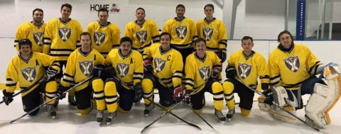 Colby Harris, Law’19 (2nd left) and his Queen’s Law hockey teammates, shown before a game at the Invista Centre, are partnering with the Law Faculty and Kingston Frontenacs for the 2018 Winter Classic.