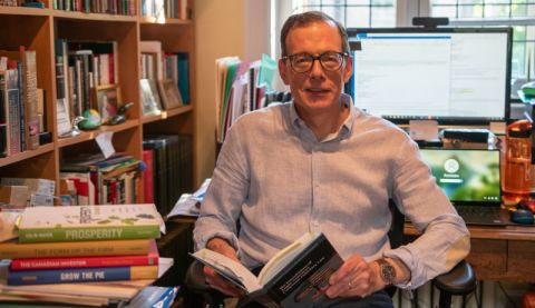 Professor Yalden researches his latest corporate law project from his home office. 