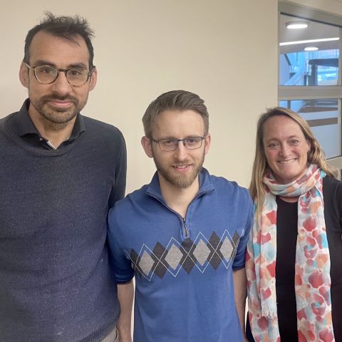 New doctoral graduate and Mackesy Smye lawyer Devan Schafer (middle), LLM’19, PhD’24 – shown with Professor Colin Grey and supervisor Associate Dean Cherie Metcalf after successfully defenced his thesis – has developed a practical framework for a systemic way to explain individual decisions made by administrative boards and tribunals. 