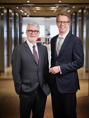 Gowlings’ outgoing Chair and CEO Scott Jolliffe, Law’76, and his successor Peter Lukasiewicz, Law’79. (Photo by Matthew Plexman)