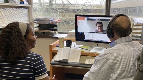 Nick Bala, Law'77, trials remote teaching with Zoom conferencing software, supported by IT staff member Theresa Afolayan with student Zach Rudge among the students online on March 14.  
