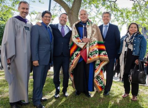 Douglas Cardinal, LLD’18 (third right), outside Grant Hall on June 6 with Dean Bill Flanagan; Ovide Mercredi, former National Chief of the Assembly of First Nations; David Sharpe, Law’95, CEO of Bridging Finance Inc.; Mark Dockstator, President of the First Nations University of Canada; and Ann Deer, Indigenous Recruitment and Support Coordinator at Queen’s Law. (Photo by Greg Black)