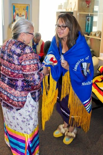 Elder Isabelle Morris of Tataskweyak Cree Nation congratulates Loretta Ross on her appointment as Treaty Commissioner for Manitoba. (Photo by Monique Lariviere, TRCM)
