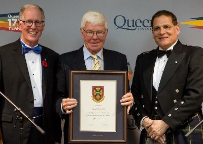 David Pattenden, Law’71, LLD’03, accepts his Distinguished Service Award from Chancellor Jim Leech and Principal Daniel Woolf, at the University Council Dinner in Ban Righ Hall on Nov. 5. (Photo by Garrett Elliott)