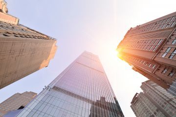 A photo of the sun among highrises