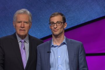 Jeopardy winner Jordan Nussbaum, Law’15, on the set with host Alex Trebek for what was a “fun” and “pretty surreal” experience. (Photo by Jeopardy! Productions Inc.)