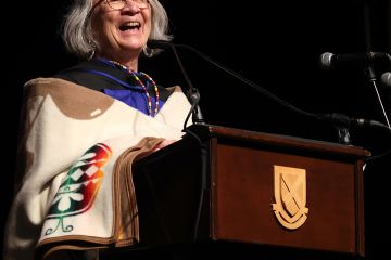 Queen’s honorary degree recipient Professor Val Napoleon, the Law Foundation Chair of Indigenous Justice & Governance at the University of Victoria, presents her Convocation address to the Queen’s Law Class of 2024 on June 21. (Photo by Bernard Clark)