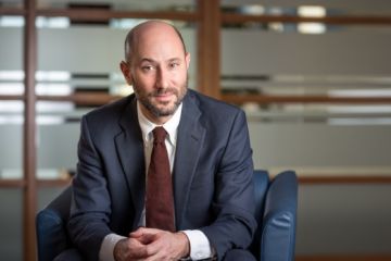 Professor Noah Weisbord is working on his first book, “an insider’s account of the high-stakes fight to define the crime of aggression, now a prosecutable international crime." (Photo by Andrew Van Overbeke)