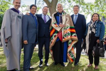 Douglas Cardinal, LLD’18 (third right), outside Grant Hall on June 6 with Dean Bill Flanagan; Ovide Mercredi, former National Chief of the Assembly of First Nations; David Sharpe, Law’95, CEO of Bridging Finance Inc.; Mark Dockstator, President of the First Nations University of Canada; and Ann Deer, Indigenous Recruitment and Support Coordinator at Queen’s Law. (Photo by Greg Black)