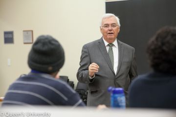 Attorney General John Gerretsen, Law '67, answers students' questions at a Q&A in Macdonald Hall.