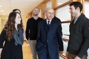 Photo by Greg Black. Justice Marshall Rothstein of the Supreme Court of Canada chats with students in Macdonald Hall during his two-day visit to Queen's Law.