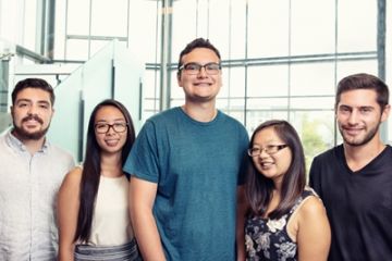 The first BCom/JD students – Zac Cooper, Diane Wu, Josh Sherkin, Jennifer Mak and Daniel Baum – in the atrium of Macdonald Hall, where they have begun their law studies in the new combined program. (Photo by Andrew Van Overbeke)
