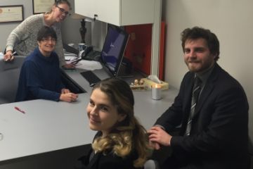 QLA’s Jodie-Lee Primeau (standing), Susan Charlesworth, Law’81, Olga Michtchouk, Law’18, and articling student William McDiarmid, Law’16 at the Queen’s Law Clinics in downtown Kingston.