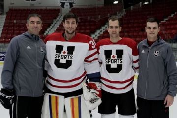 Kevin Bailie, Law’19 (second left) at the Team Canada training camp at Centre d’Excellence Sports Rousseau in in Boisbriand, Québec with U Sports and Queen’s coach Brett Gibson, team-mate Spencer Abraham, and U Sports and Queen’s athletic therapist James Sawchuk.